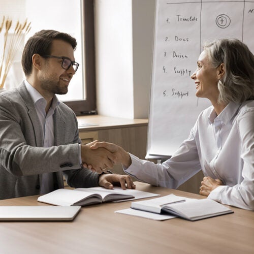 HR managers shaking hands